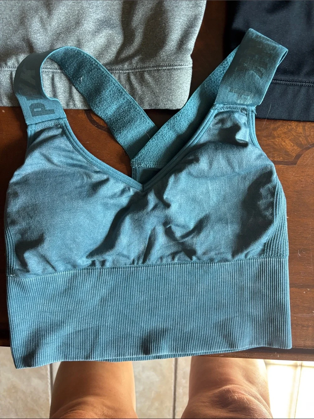 2 Nike and 1 pink Victoria’s Secret Gray Dri-FIT Racerback Sports Bra